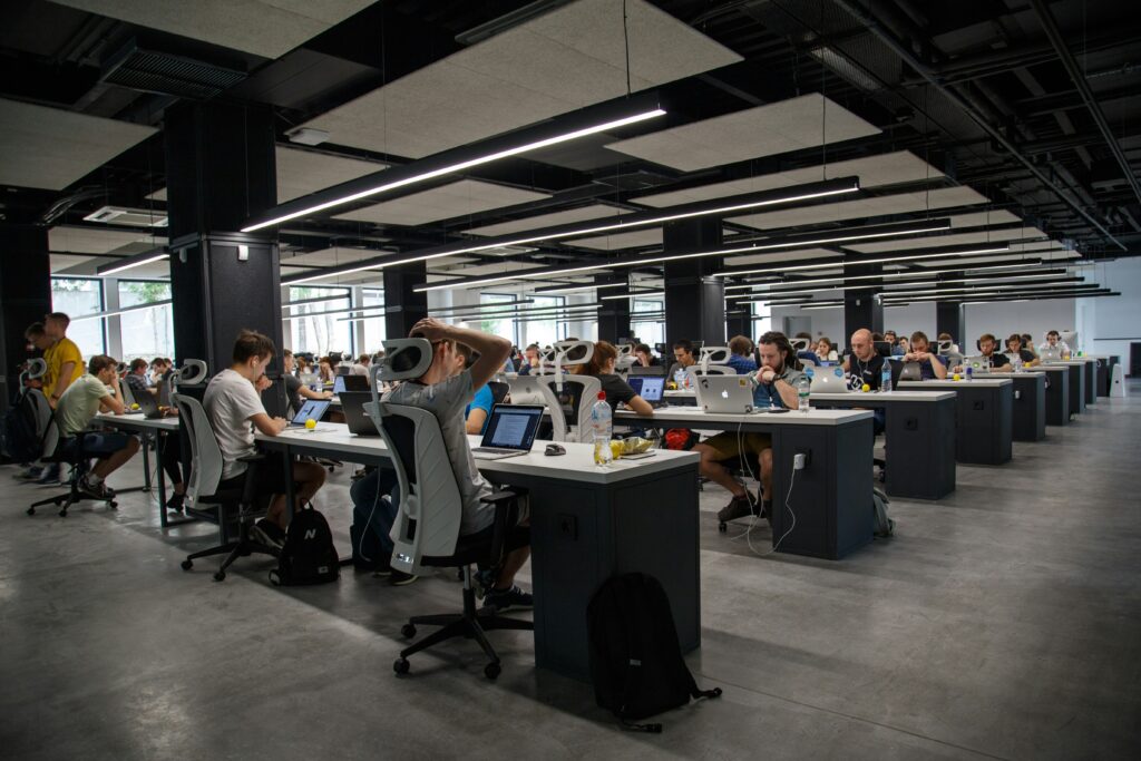 Open-plan office with a multitude of workers at their desks