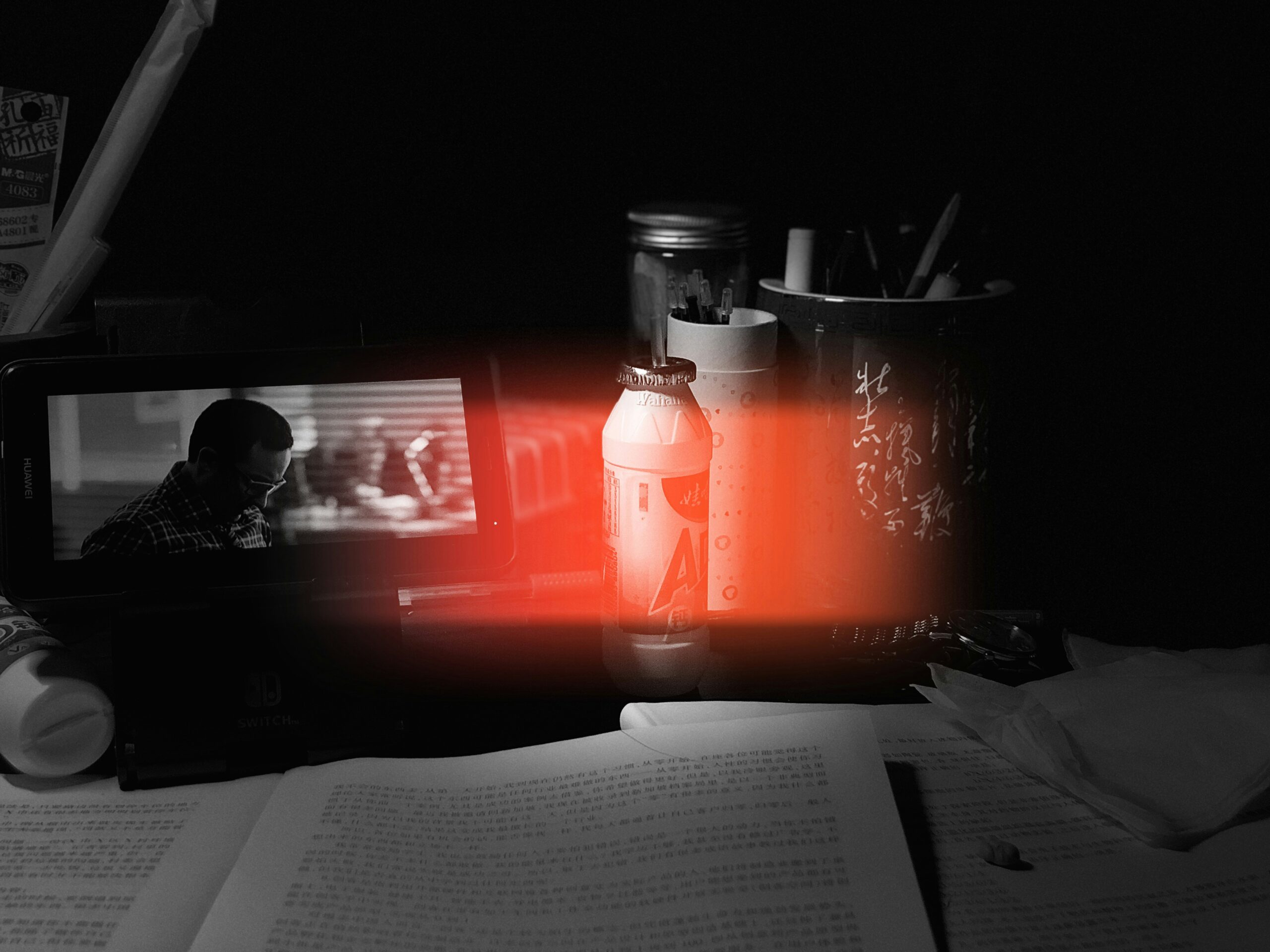 Desktop covered in papers and a tablet as a symbol for procrastination