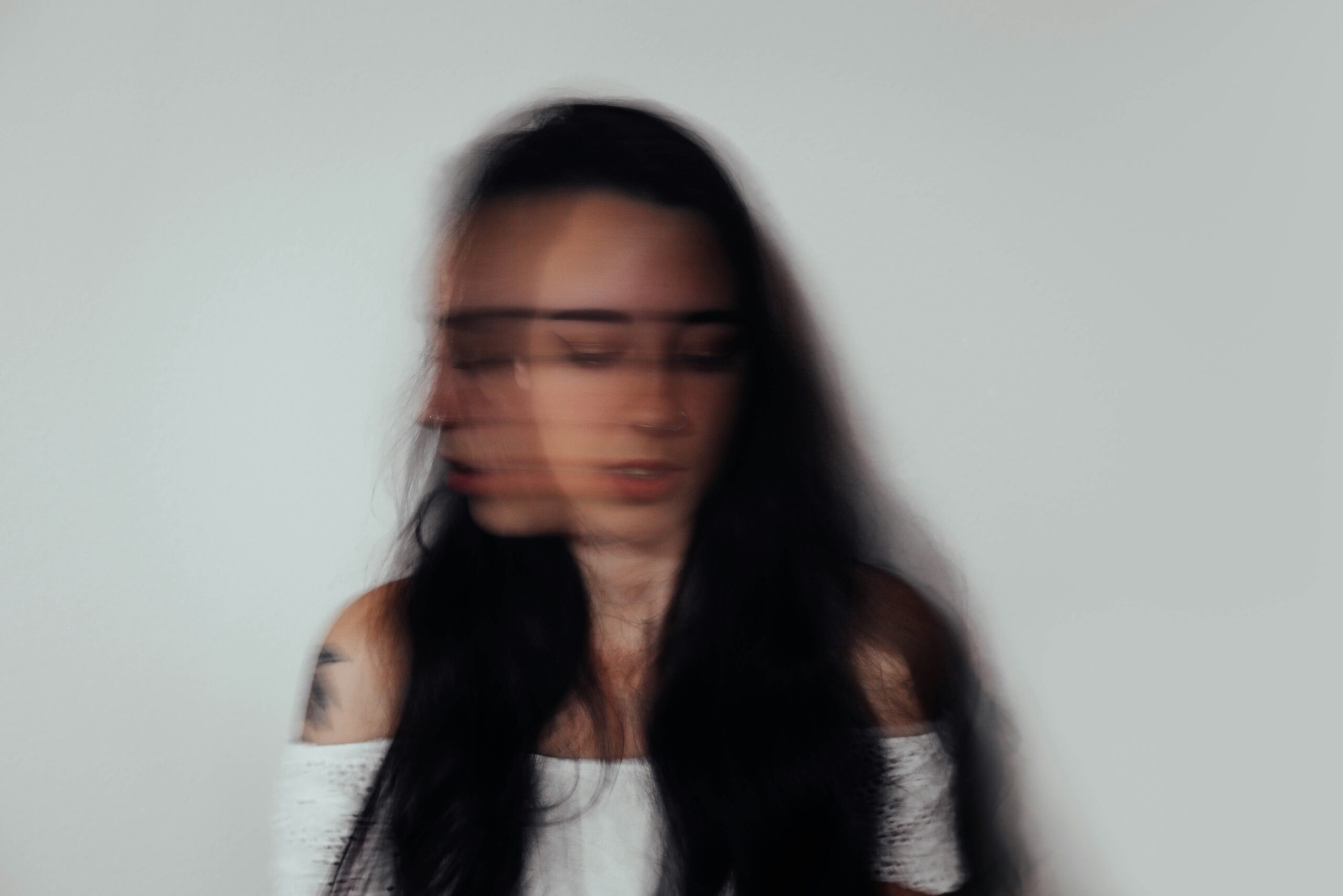 Woman with motion blur effect, symbolising anxiety