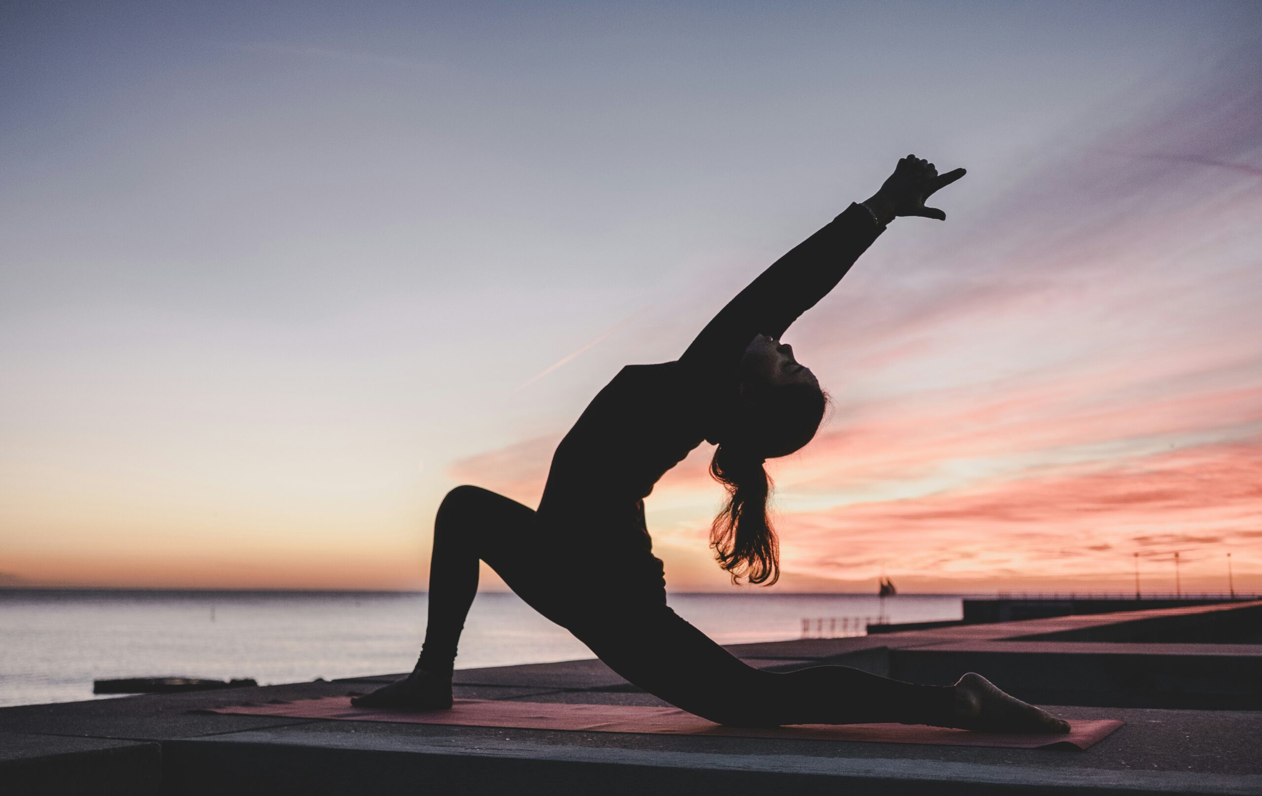 Yoga pose in front of a sunset